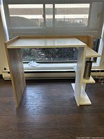 Front and right side view of the white and light wood modern desk with 3 shelving units showing design and shelving