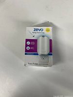 Front view of Zevo flying insect trap starter kit box showing brand, product type, and included contents.