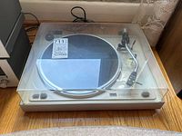 Full view of turntable with clear dust cover on