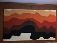 Full front view of textile wall hanging on wood-paneled wall