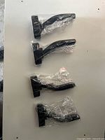 Four sealed guitar wall mounts side view