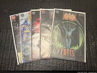 Front view of all five bagged comics spread out