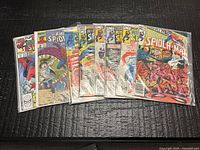 All eight bagged Spectacular Spider-Man issues fanned out