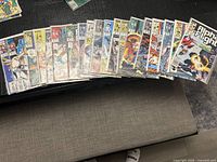 Spread of 19 bagged Alpha Flight comics on table