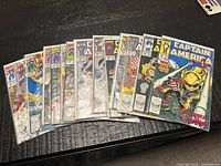 All thirteen Captain America comics fanned out showing covers