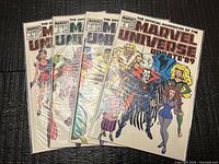 Front view of all four bagged comics fanned out