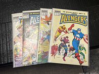 Four bagged issues stacked, showing covers and numbering