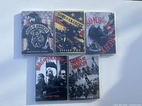 Front view of sealed DVD cases for Sons of Anarchy Seasons One through Five