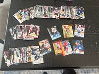 Wide view of all hockey card stacks on table