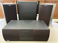 Front view showing two bookshelf speakers, centre speaker and subwoofer