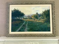 Front view of framed painting showing orchard landscape