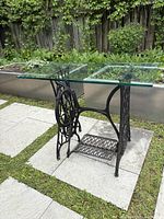 Front side view of the Singer sewing machine base with glass top, showing base and glass dimensions and condition