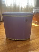 Front view of the vintage retro style purple metal laundry basket showing its overall shape and color.