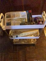 Cart front view showing three trays and contents