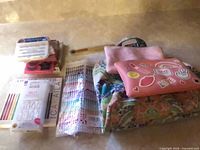 Group shot showing all eyelash packs, nails, rhinestones, pouches, brush