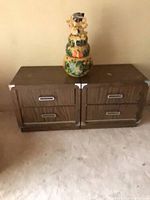 Pair of nightstands with stacked planters on top