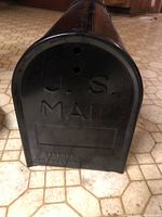 Front view showing embossed U.S. MAIL door and overall shape