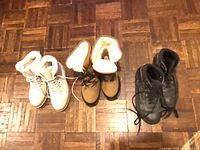 All three pairs of winter boots side by side showing colors and general condition