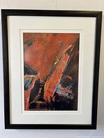 Front view of framed Vlasta Kelemen mixed media abstract painting with white mat and black frame against white wall.