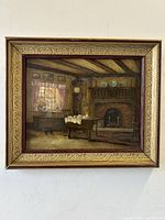 Frontal view of the Victorian interior oil painting in ornate carved frame hanging on wall
