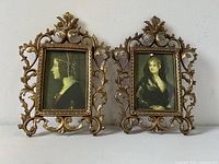 Pair of solid brass picture frames with ornate Gothic Florentine designs displayed front facing.