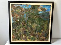 Front view of the framed vintage mixed media painting showing rainforest island scene with textured leaves and sky.