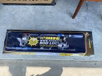 Photo of the fishing rod and reel inside the HT Enterprises branded Rod Locker Kit package showing the full kit and packaging design