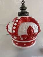 Front view showing red and white crown shape