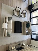 Full view of rug under living room furniture, showing overall size, layout and color.