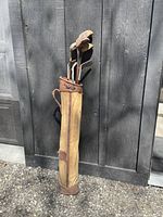 Full view of the golf club carry bag standing upright containing multiple golf clubs with visible wear.