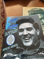 Photo of 'Private Presley' book with black and white close-up of Elvis on cover and CD sticker.