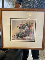 Full view of the framed print showing flowers in pots on stone steps.