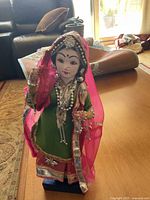 Front view of the Indian doll figurine showcasing detailed clothing and jewelry.