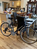 Full view of the Ridgeback hybrid bike, showing frame, wheels, saddle, handlebars, and rear cargo rack.