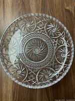 Top view of the round crystal cake stand showing cut pattern designs including circular star patterns and lattice work.