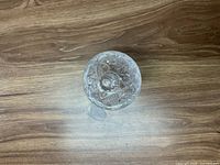 Top down view of the etched crystal glass candy dish showing detailed floral etching on the lid and dish.