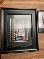 Framed Montreal Canadiens Stanley Cup championship banners with team logo and Stanley Cup images in black frame with beaded edge