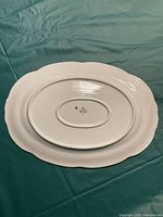Back of oval ceramic serving tray showing manufacturer mark and number 16