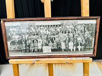 Full view of framed panoramic group photo showing entire group and frame condition.