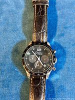 Front view of Caravelle chronograph wristwatch showing dial, subdials, and chronograph buttons.