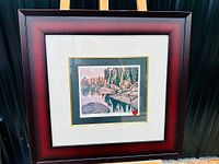 Front view of the framed print of Algoma Reflections by Lawren Harris with a reddish-brown wooden frame.