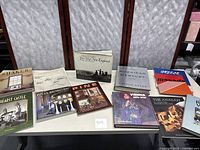 Books arranged on table showing varied titles and cover art focused on architecture and history themes.