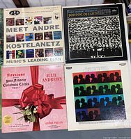 Four vinyl album covers including Meet Andre Kostelanetz, Festival of Faith, Julie Andrews Christmas Carols, and Hugo Montenegro Conducts