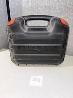 Closed black plastic carrying case with Black & Decker branding visible on the front.