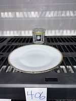 Photo of Fire King white plate with gold rim and Playbill clear drinking glass showing size and condition.