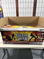 Box for Guitar Hero World Tour Complete Band Game for Xbox 360 showing game branding and pricing.