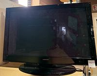 Front view of Samsung 42-inch plasma TV showing screen, bezel, and base stand.