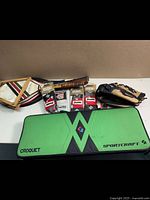 Sportcraft croquet set mallets, balls, carrying case, several baseball batting gloves, and Rawlings softball glove