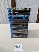 Stack of 19 Blu-Ray movie cases showing titles and condition.
