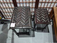 Top-down view of the two bamboo nesting end tables showing the larger and smaller table with woven chevron-finished tops and bamboo legs.